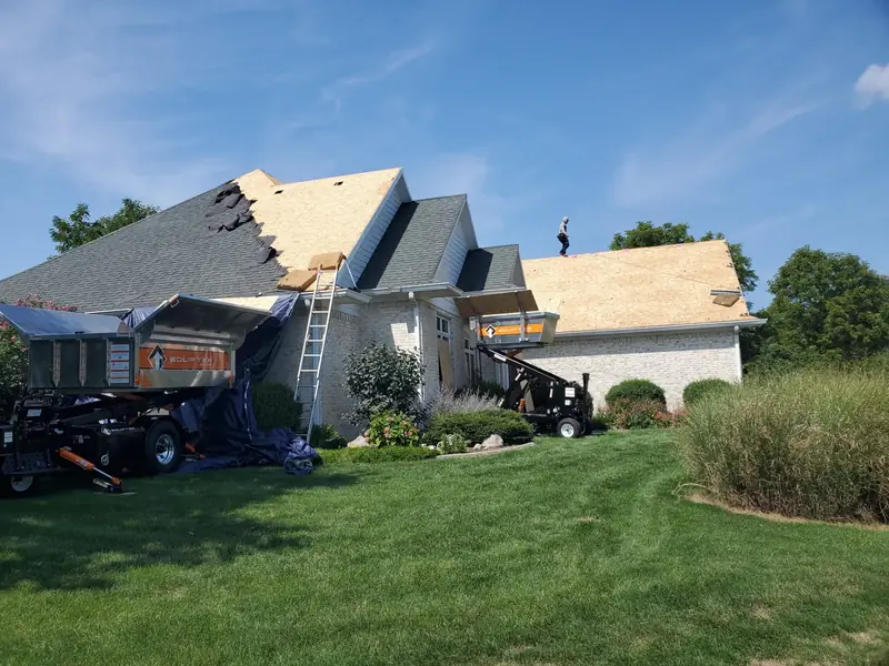 Storm damage roof tear-off and repair by Rick's Roofing in Indiana